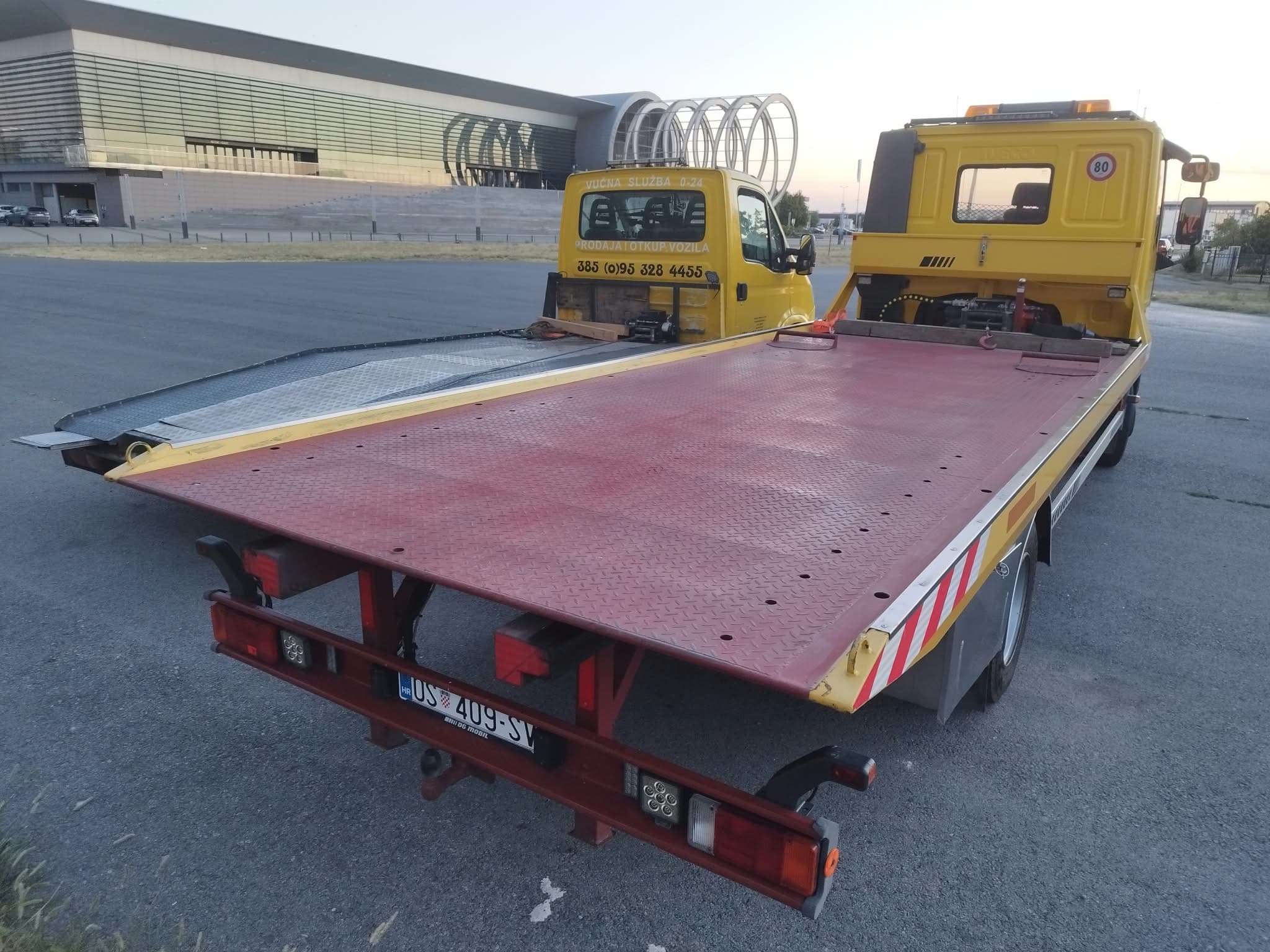 Nikolić tow truck with an empty flatbed, ready for loading