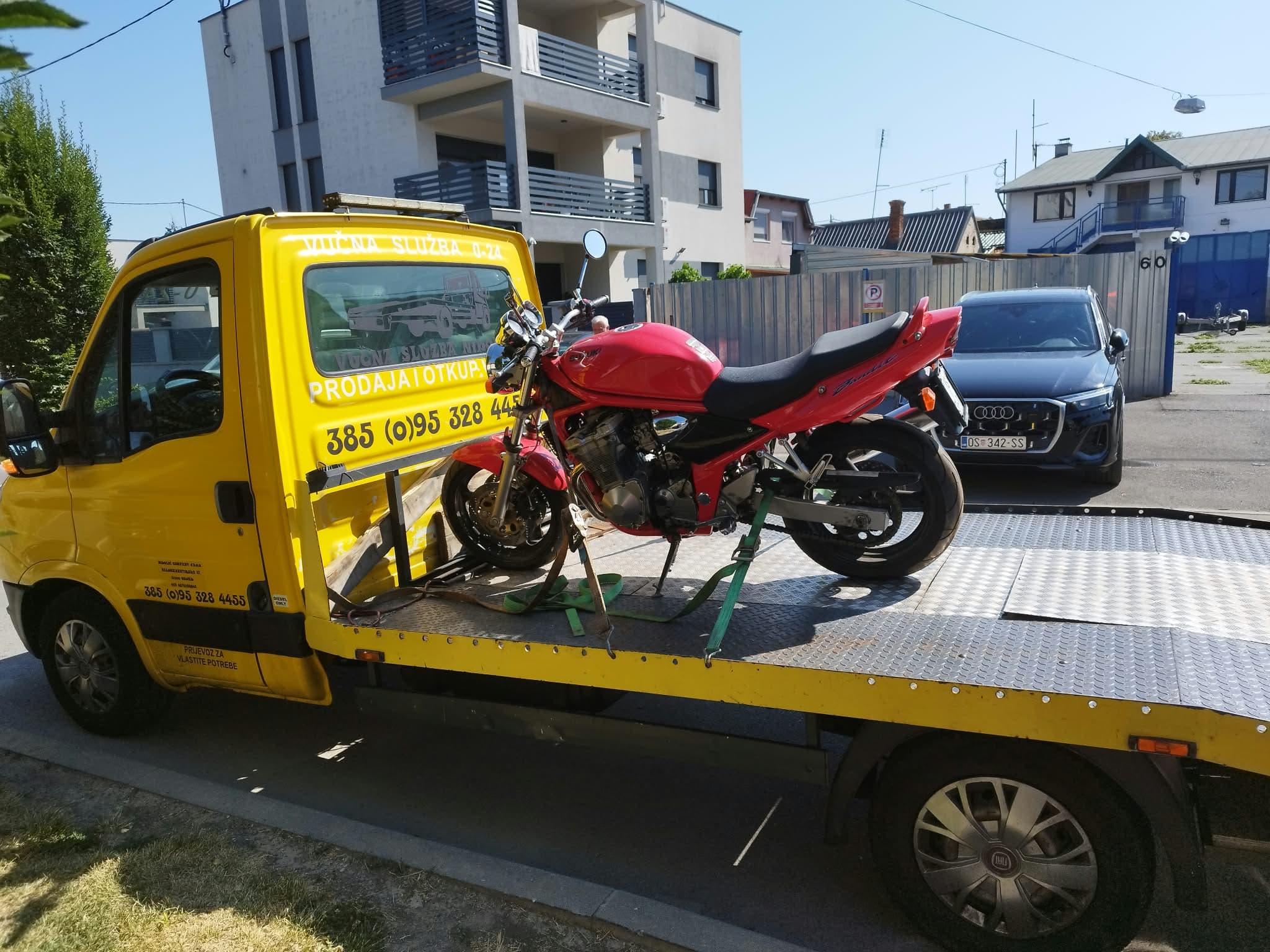 Suzuki Bandit motorcycle strapped down on a Nikolić flatbed