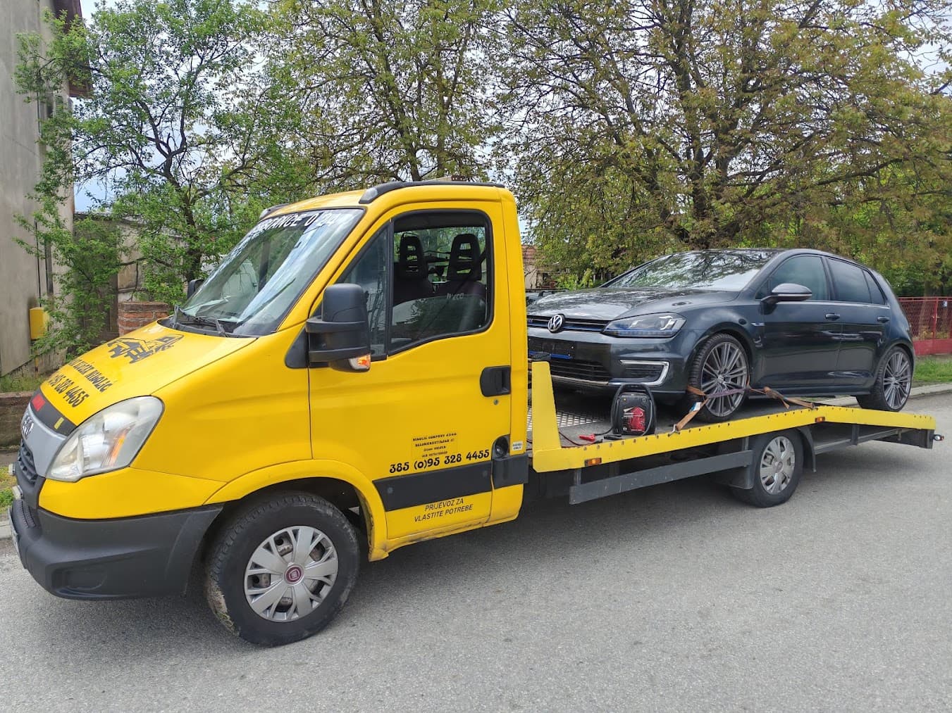 Tow truck with a loaded Volkswagen Golf